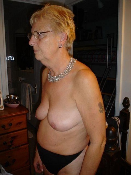 wrinkled grandma spreading photos